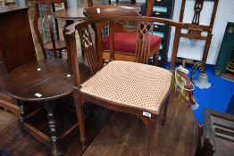 An Edwardian mahogany corner chair having line inlay decoration and later gold and burgundy
