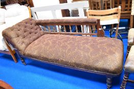 A Victorian mahogany day bed having moquette style upholstery
