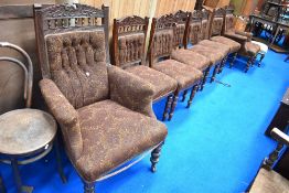 A Victorian salon suite comprising two arm chairs and six dining chairs, all having moquette
