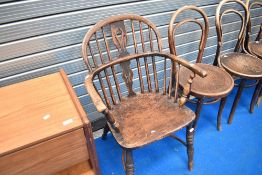 A 19TH Century Windsor style armchair having spindle back and turned frame