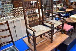 A 19th Century vernacular spindle back chair having rush seat