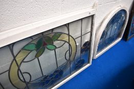 Two leaded and coloured glass window panes
