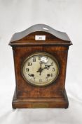 An early 20th century bracket style mantel clock of military interest with oak case and presentation
