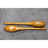 A pair of Victorian Hardwood Indian Clubs or Exercise Meels with worn patina.