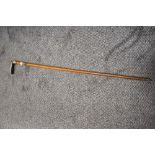 A Victorian walking cane, having hall marks for Birmingham, circa 1897/8 embossed cuff to neck and