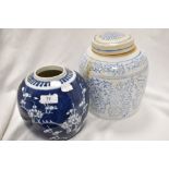 Two antique Chinese ginger jars, one with traditional prunus decoration and a similar larger jar