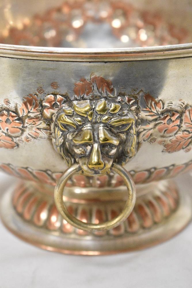 An early 20th century silver plated punch bowl with lion head handles and impresses floral boarder. - Image 2 of 3