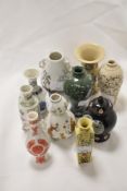 A collection of 20th century miniature Oriental style vases.