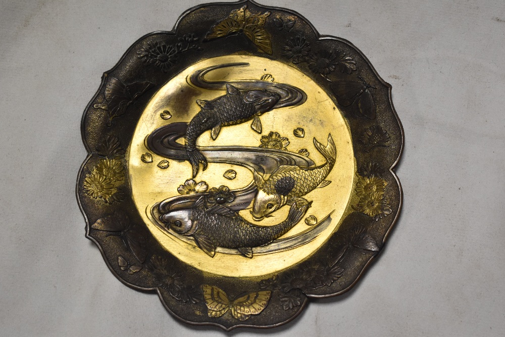 Two antique Japanese mixed metal dishes embossed with designs of two carp swimming and a pair of - Image 2 of 3