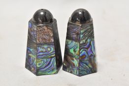 An Edwardian salt and pepper cruet set having mother of pearl inlay over a white metal body