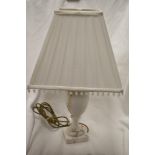 A vintage marble stone carved lamp base with square shade.