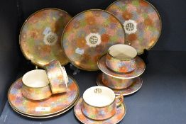 A Japanese Satsuma ware part tea service decorated in the millefiori pattern with gilt decoration.