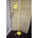 A vintage standard lamp in yellow.