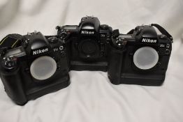 Three Nikon D1x bodies with soft camera bag