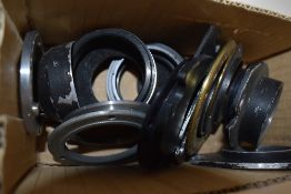 A box of various lens mounts