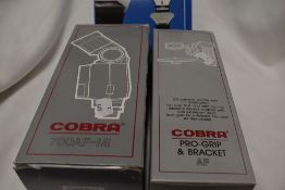 A Cobra 700AF Mi flash and a Cobra pro grip and bracket