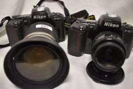 Two Nikon F-601 cameras one with AF Nikkor 1:3,3-4,5 35-70mm lens the other with Vivitar Series1