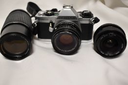 A Pentax MG with SMC Pentax-M 1:2 50mm lens, a Cosina 28mm 1:2,8 lens and a Bell & Howell1:4,5 80-