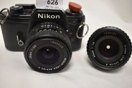 A Nikon EM camera with Nikon Series E 28mm 1:2,8 lens and 50mm 1:1,8 lens