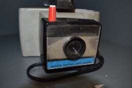 A Polaroid Swinger Sentinal Land Camera