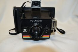 A Polaroid Instant 30 camera