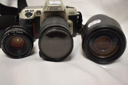 A Nikon F60 camera with Nikon AF Nikkor 28-80mm lens, Nikon AF Nikkor 70-300mm lens and Pentax -