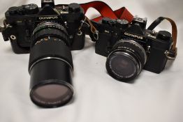 Two Olympus OM-2 cameras with Olympus Zuiko 1:4 f75-150mmlens, Olympus Zuiko 1:2,8 f-35mm lens and