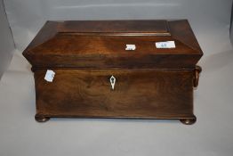 A fine Georgian casket form Walnut cased tea caddy with bun feet carved wood handles and complete
