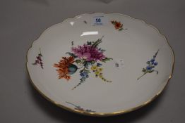 An antique German porcelain bowl bearing the Meissen crossed swords mark to base and hand