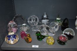A good collection of vintage art glass paper weights including animal studies and lamp worked.
