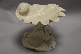 A Royal Worcester swan form table centre having shell bowl with swan stem and shell form base. In