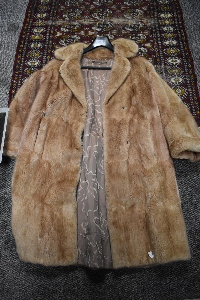 A vintage full length ladies fur coat.