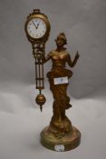 A Victorian French bronzed mystery Diana swinging arm mantel clock timepiece with Junghans movement,
