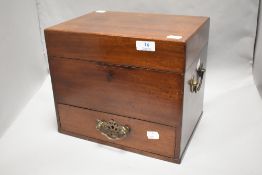 A Victorian mahogany travel case with central storage compartment with under drawer. 25cm tall