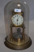 An early 20th century German made 400 day anniversary clock with glass dome.