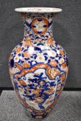 A large early 20th century Japanese floor standing vase decorated in an Imari palette. 61cm tall