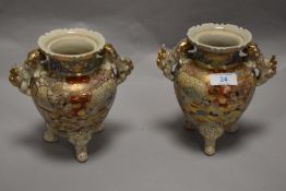 A pair of reproduction Japanese Koro decorated in a Satsuma style.