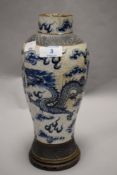 An 19th century Chinese export blue and white crackle glaze vase decorated with twin dragons and sky