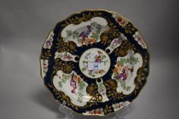 A first period Worcester dish highly decorated with gilt and cobalt with three medallions of