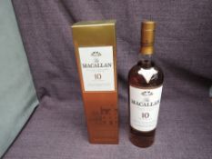 A bottle of The Macallan 10 Year Old Highland Single Malt Scotch Whisky, matured in selected