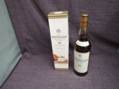 A bottle of late 1990's/ early 2000's The Macallan 10 Year Old Single Highland Malt Scotch Whisky,