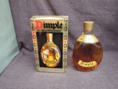 A bottle of Haig & Co Dimple Deluxe Scotch Whisky, 70% proof, 26 2/3 fl oz, in original box