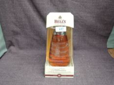 A bottle of Bell's Extra Special 8 Year Old Blended Whisky, Millennium 2000, 40% vol, 70cl in