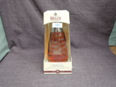 A bottle of Bell's Extra Special 8 Year Old Blended Whisky, Millennium 2000, 40% vol, 70cl in