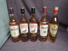 Five bottles of Blended Scotch Whisky, Bell's 8 Year, Bell's Original, The Famous Grouse x2 and