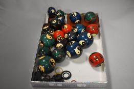 A selection of Chinese Boading balls, with wooden block and rubber rings stands