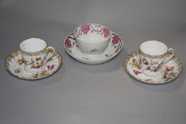 An 18th century English Newhall Porcelain type teabowl and saucer with typical foliate decoration,