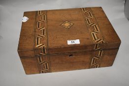 A 19th century inlaid mahogany box, of hinged rectangular form decorated with bands of geometric