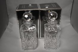 A pair of Edinburgh Crystal decanters, of canted square section form with globular facet-cut