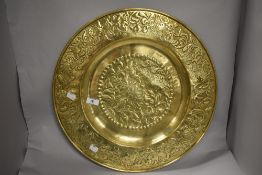 A large Keswick School of Industrial Arts 'KSIA' brass charger, of dished circular form, the
